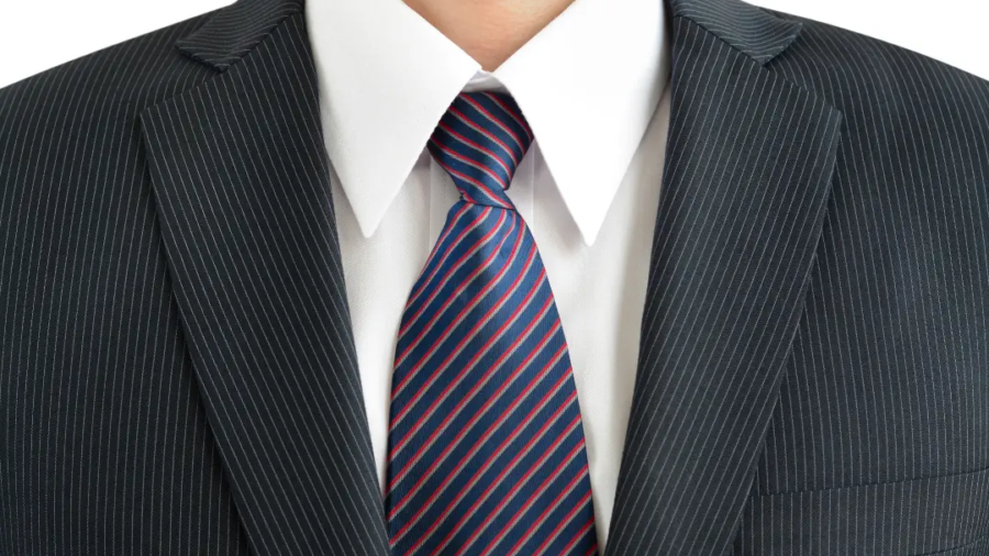 Step-by-step guide showing a student tying a school uniform tie, with instructions for achieving a neat and properly fitted knot.